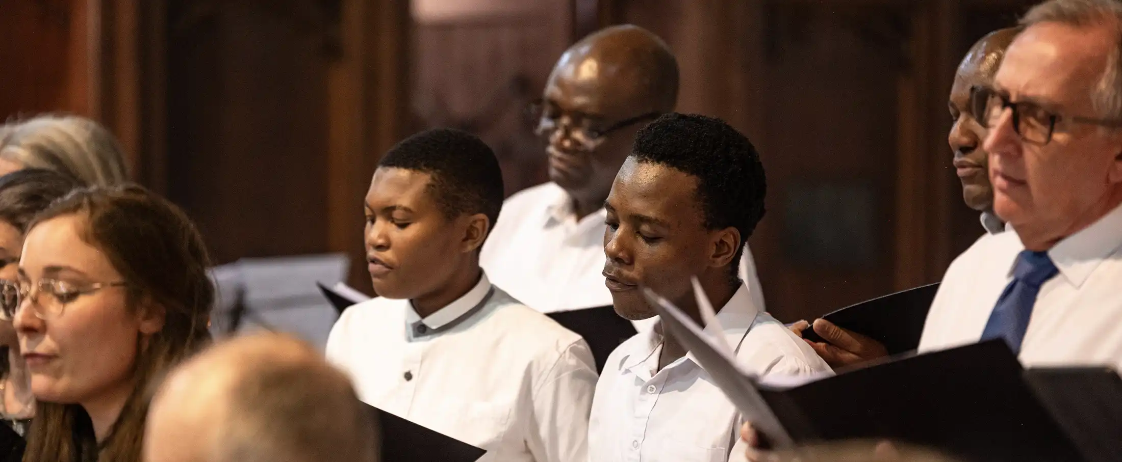 Durban Chamber Choir singing together during a live performance